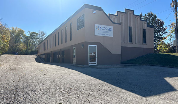 photo of building in a parking lot.